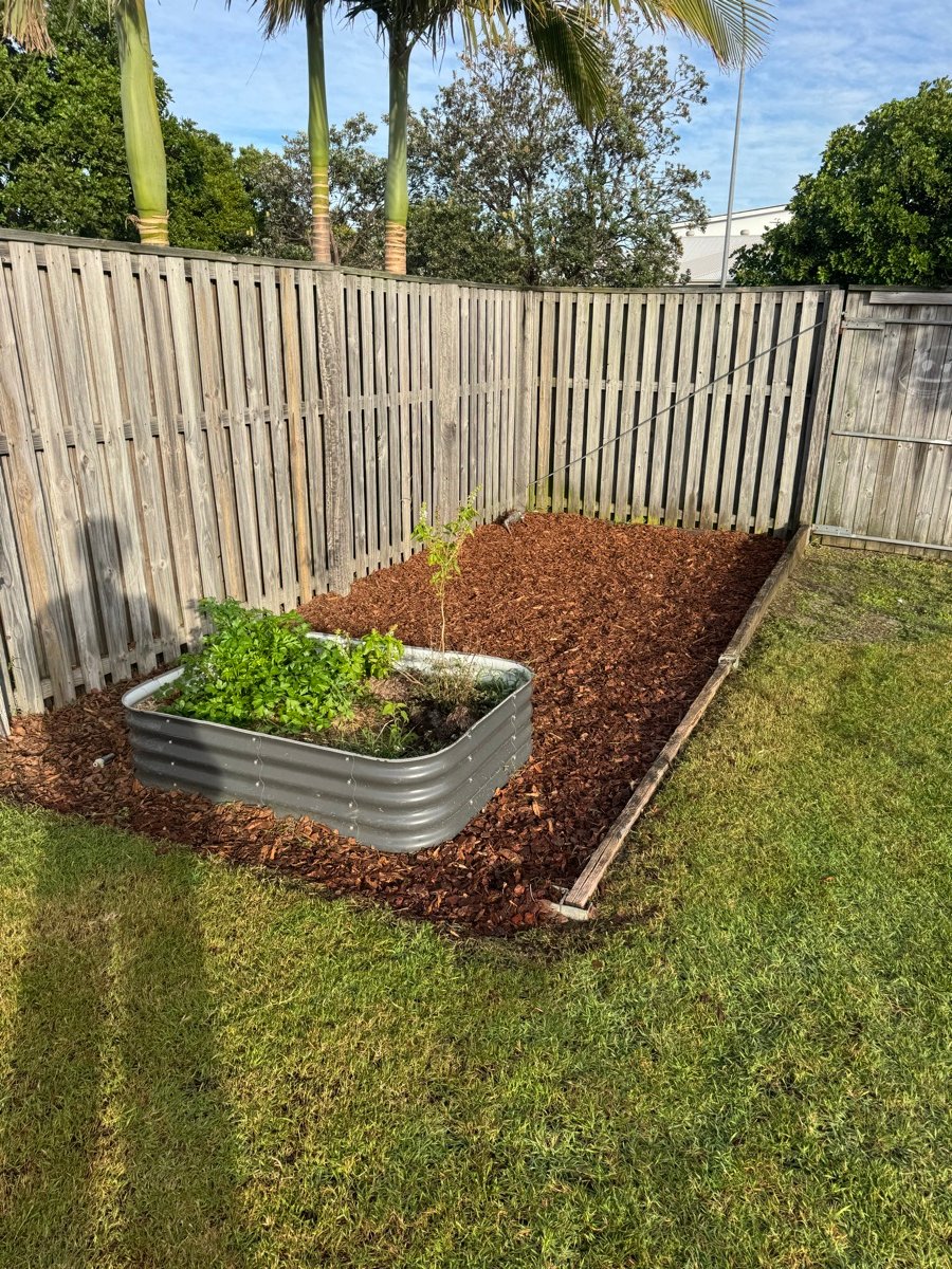Fresh mulch and a tidy raised garden bed