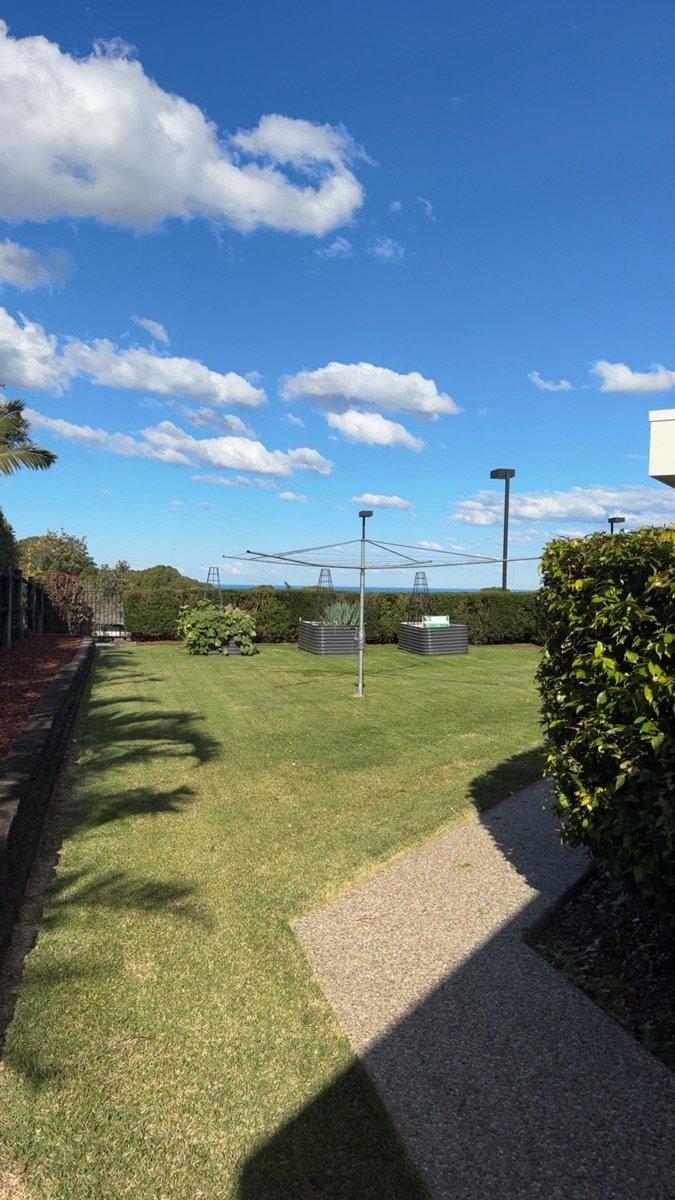 Freshly cut lawn with a rotary clothesline
